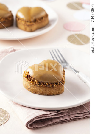 Heart shape vanilla tart with nuts. Valentine's Day. Heart shape vanilla tart with nuts. Valentine's Day. 73458066
