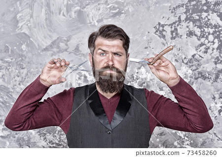 serious man with long facial hair. brutal barbershop  73458260