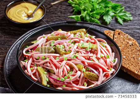 German wurstsalat of sausage and pickled cucumbers German wurstsalat of sausage and pickled cucumbers 73458333