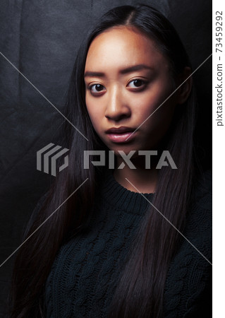 pretty young asian girl posing sensitive on black background, lifestyle people concept pretty young asian girl posing sensitive on black background, lifestyle people concept 73459292