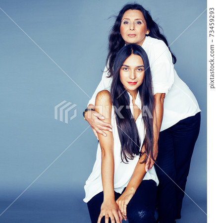 cute pretty teen daughter with mature mother hugging, fashion style brunette, lifestyle people concept cute pretty teen daughter with mature mother hugging, fashion style brunette, lifestyle people concept 73459293
