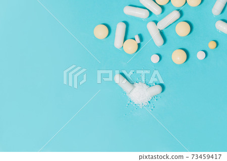 close up. capsules with medicine and tablets on the table. 73459417