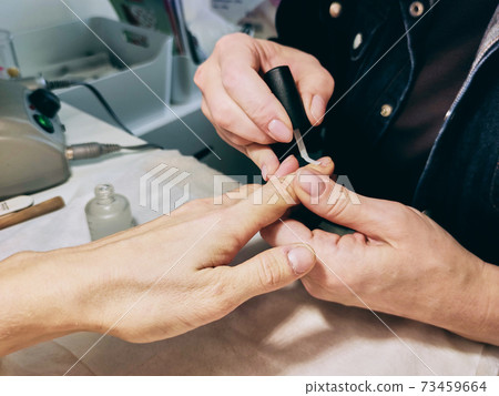 Closeup Of Beautiful Female Hands Applying Transparent Nail Polish Closeup Of Beautiful Female Hands Applying Transparent Nail Polish 73459664