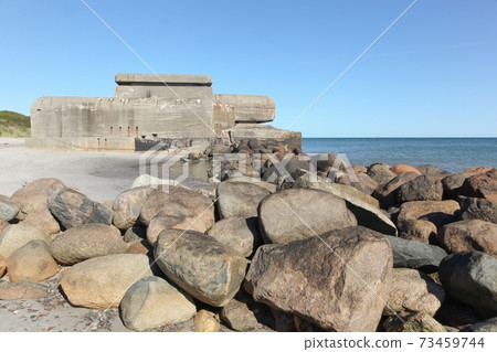 The beach in Skagen with an old bunker, Denmark The beach in Skagen with an old bunker, Denmark 73459744