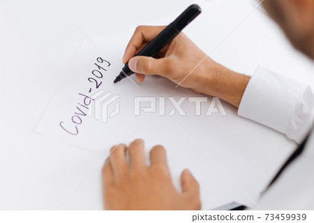 business man taking notes on business development during the quarantine period . business man taking notes on business development during the quarantine period . 73459939