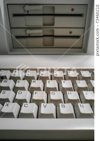 Antique computer keyboard and 5 inch disk drives Antique computer keyboard and 5 inch disk drives 73460218