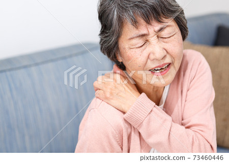 Senior woman stiff shoulders Senior woman stiff shoulders 73460446