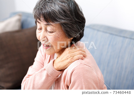 Senior woman stiff shoulders Senior woman stiff shoulders 73460448