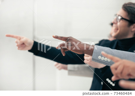group of smiling business people pointing pointing forward group of smiling business people pointing pointing forward 73460484