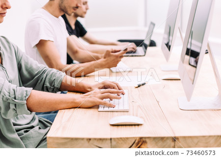 close up. the business team analyzes the information coming to the office. close up. the business team analyzes the information coming to the office. 73460573