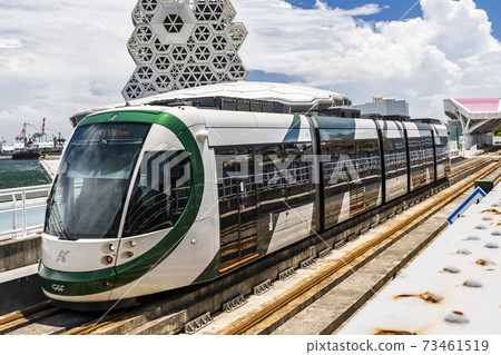 View of light rail train and the skyline in Kaohsiung, Taiwan. The light rail system in Kaohsiung is the first light rail transit in Taiwan. 73461519