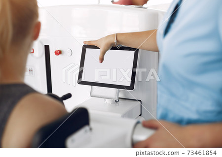 Woman at physiotherapy making physical exercises with qualified therapist 73461854