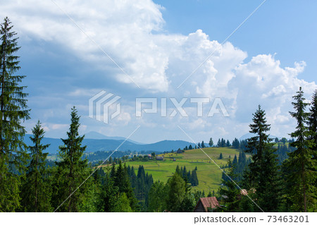 Beautiful summer landscape of village among Karpaty mountains Beautiful summer landscape of village among Karpaty mountains 73463201