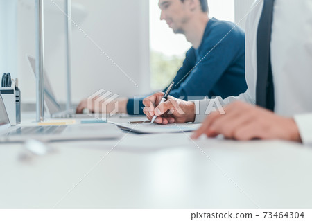 close-up. image employees work with financial documents. close-up. image employees work with financial documents. 73464304