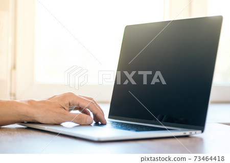close up. male using a modern laptop. close up. male using a modern laptop. 73464418