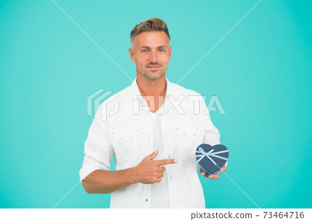 Look here. Handsome man buy gift for girlfriend. Valentines day 73464716