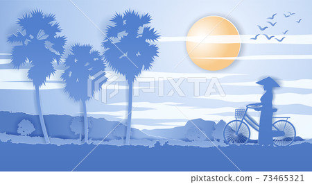Vietnamese woman hold bicycle walk pass rice field and palm tree on sunset time Vietnamese woman hold bicycle walk pass rice field and palm tree on sunset time 73465321