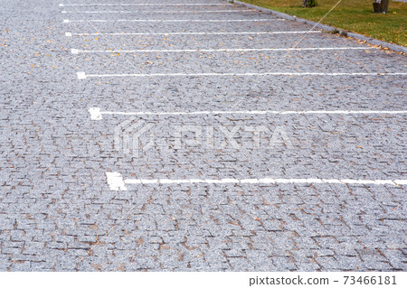 empty parking for cars with free lots outdoors in the park area of the city, close up side view. empty parking for cars with free lots outdoors in the park area of the city, close up side view. 73466181
