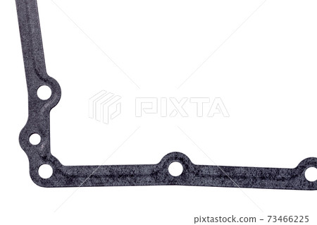 Seal gasket for gearbox pallet with hole, replaceable car part close up on white background. Seal gasket for gearbox pallet with hole, replaceable car part close up on white background. 73466225