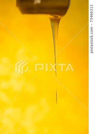 Pouring stream of caramel sauce Pouring stream of caramel sauce 73466315