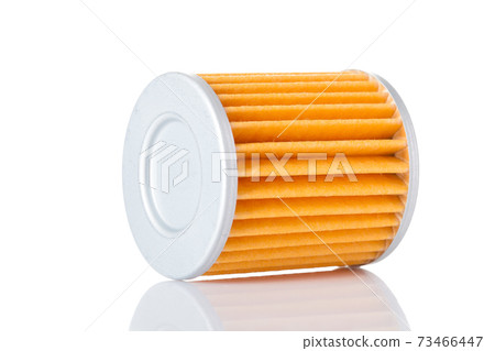 Car filter microfiber orange paper for cleaning lying on its side, isolated spare part on a white background with reflection. 73466447