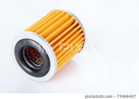 car paper filter assy-oil  on a white background casts a shadow with empty copy space for text, close-up of the car spare part. 73466487