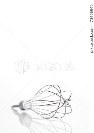 a whisk culinary device iron nozzle for a mixer on a white vertical banner with copy space for text. 73466946