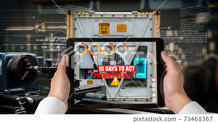 Engineer use augmented reality software in smart factory production line 73468367