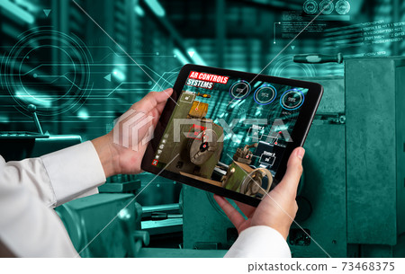 Engineer use augmented reality software in smart factory production line Engineer use augmented reality software in smart factory production line 73468375
