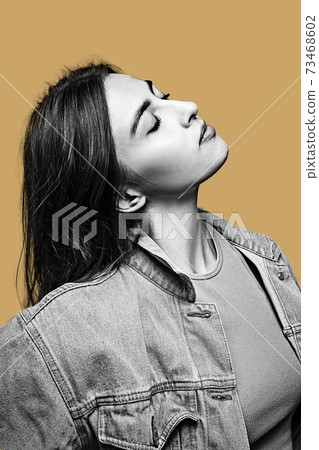 Black and white portrait of young beautiful girl isolated on light background. Black and white portrait of young beautiful girl isolated on light background. 73468602