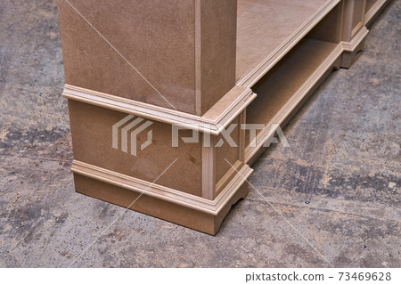 Joinery. Mdf cabinet carcass. Home library with classic design. Wooden furniture manufacturing process Joinery. Mdf cabinet carcass. Home library with classic design. Wooden furniture manufacturing process 73469628