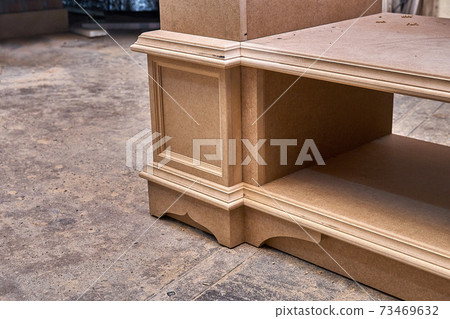 Joinery. Mdf cabinet carcass. Home library with classic design. Wooden furniture manufacturing process 73469632