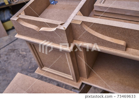 Joinery. Mdf cabinet carcass. Home library with classic design. Wooden furniture manufacturing process Joinery. Mdf cabinet carcass. Home library with classic design. Wooden furniture manufacturing process 73469633