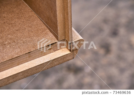 Joinery. Mdf cabinet carcass. Home library with classic design. Wooden furniture manufacturing process Joinery. Mdf cabinet carcass. Home library with classic design. Wooden furniture manufacturing process 73469636