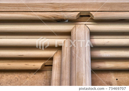 Joinery. Wooden cabinet doors. Wooden frame. Home library with classic design. Wooden furniture manufacturing process Joinery. Wooden cabinet doors. Wooden frame. Home library with classic design. Wooden furniture manufacturing process 73469707