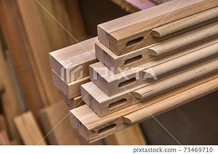 Joinery. Wooden cabinet doors. Wooden frame. Home library with classic design. Wooden furniture manufacturing process 73469710