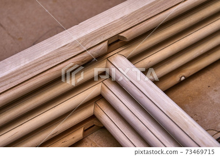 Joinery. Wooden cabinet doors. Wooden frame. Home library with classic design. Wooden furniture manufacturing process Joinery. Wooden cabinet doors. Wooden frame. Home library with classic design. Wooden furniture manufacturing process 73469715