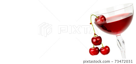 Glass of cherry juice and cherries isolated on white . Free space for text. Wide photo. 73472031