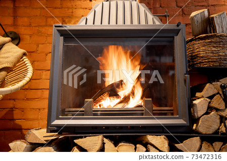 Close-up of a burning fireplace Close-up of a burning fireplace 73472316