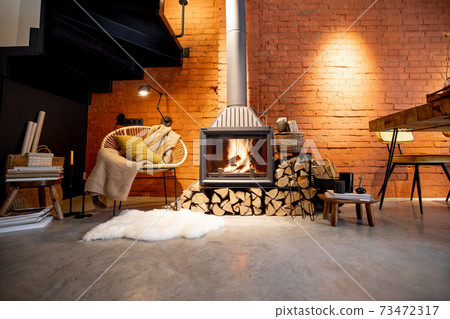 Burning fireplace with firewood at home Burning fireplace with firewood at home 73472317