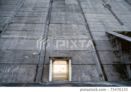 Metal door leading to the inside of the dam 73476135