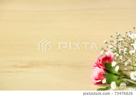 Bouquet of carnations and gypsophila placed on the desk 1 Bouquet of carnations and gypsophila placed on the desk 1 73476826