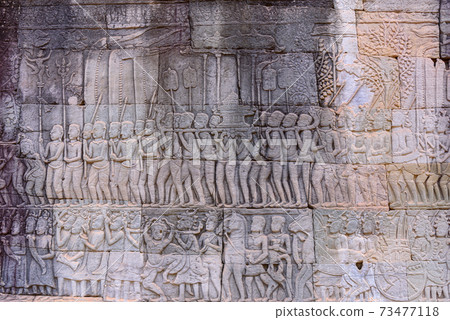 Stone carvings on the walls of the Bayon Temple in Angkor Thom 73477118