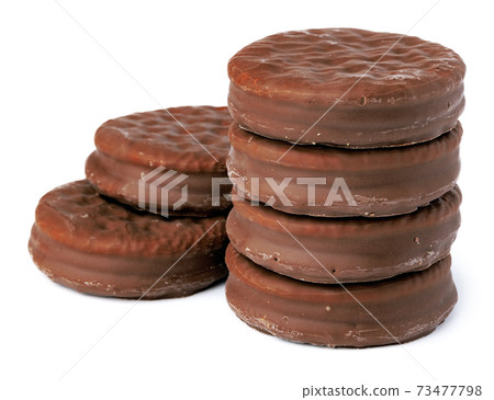 Chocolate cookies in glaze isolated on white background Chocolate cookies in glaze isolated on white background 73477798