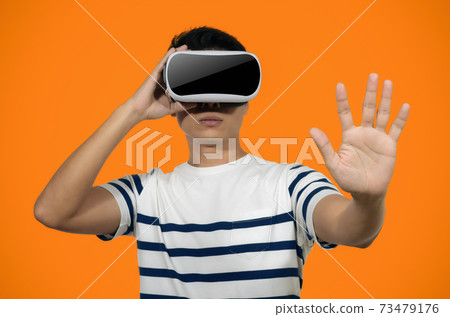 Young man with virtual reality headset. 73479176