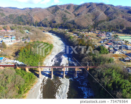 SL crossing the Arakawa bridge "Pareo Express" ~ Aerial photograph with drone (Nagami Town of Chichibu-cho, Chichibu-gun, Saitama Prefecture · Shinodano-cho Shimodano) 73479364