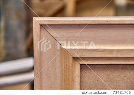 Joinery. Wooden mirror frame. Furniture manufacture. Close-up Joinery. Wooden mirror frame. Furniture manufacture. Close-up 73481706