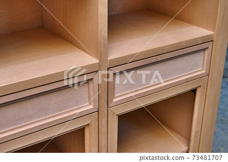 Joinery. Wooden cupboard with drawers. Furniture manufacture. Close-up 73481707
