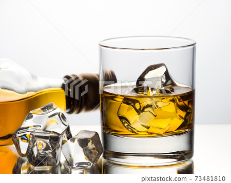 Whisky on the rocks on white background Whisky on the rocks on white background 73481810