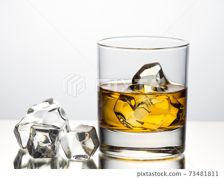 Whisky on the rocks on white background Whisky on the rocks on white background 73481811